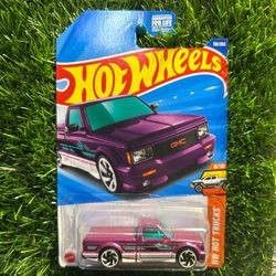 Hot Wheels 1997 GMC Sonoma pickup truck in purple and green hotwheels