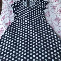 Michael Korrs black dress white poka dots size with a large and easy zipper
