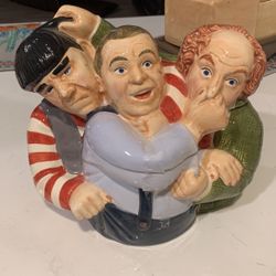 The Three St cookie jar by Clay Art . The jar Hand -painted with colorful designs and features a set-