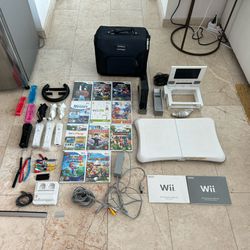Nintendo Wii Bundle With 11 Games, Wii Fit, Travel Screen, 4 Remotes, 3 Nunchuks, And Rechargeable Remotes