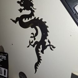 Chrome metal dragon cutout.
30 bucks Or best Offer.