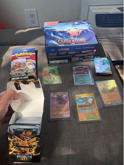 Pokémon cards and a etb with the cards loose