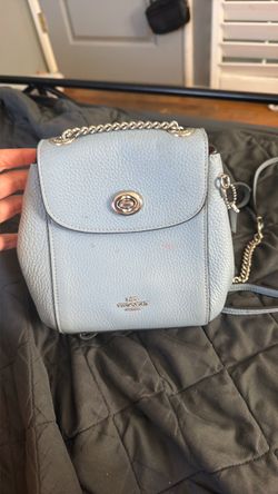 light blue small coach backpack