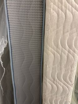 Twin mattress, wooden platform, and metal frame