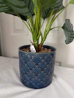 artificial plant in ceramic pot measures 25 inches tall