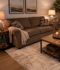 Brown 7 foot couch with throw pillows. Good condition!
