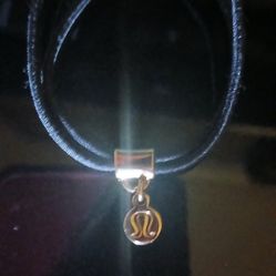 The item is a Logo Charm Hair Tie from Lululemon.