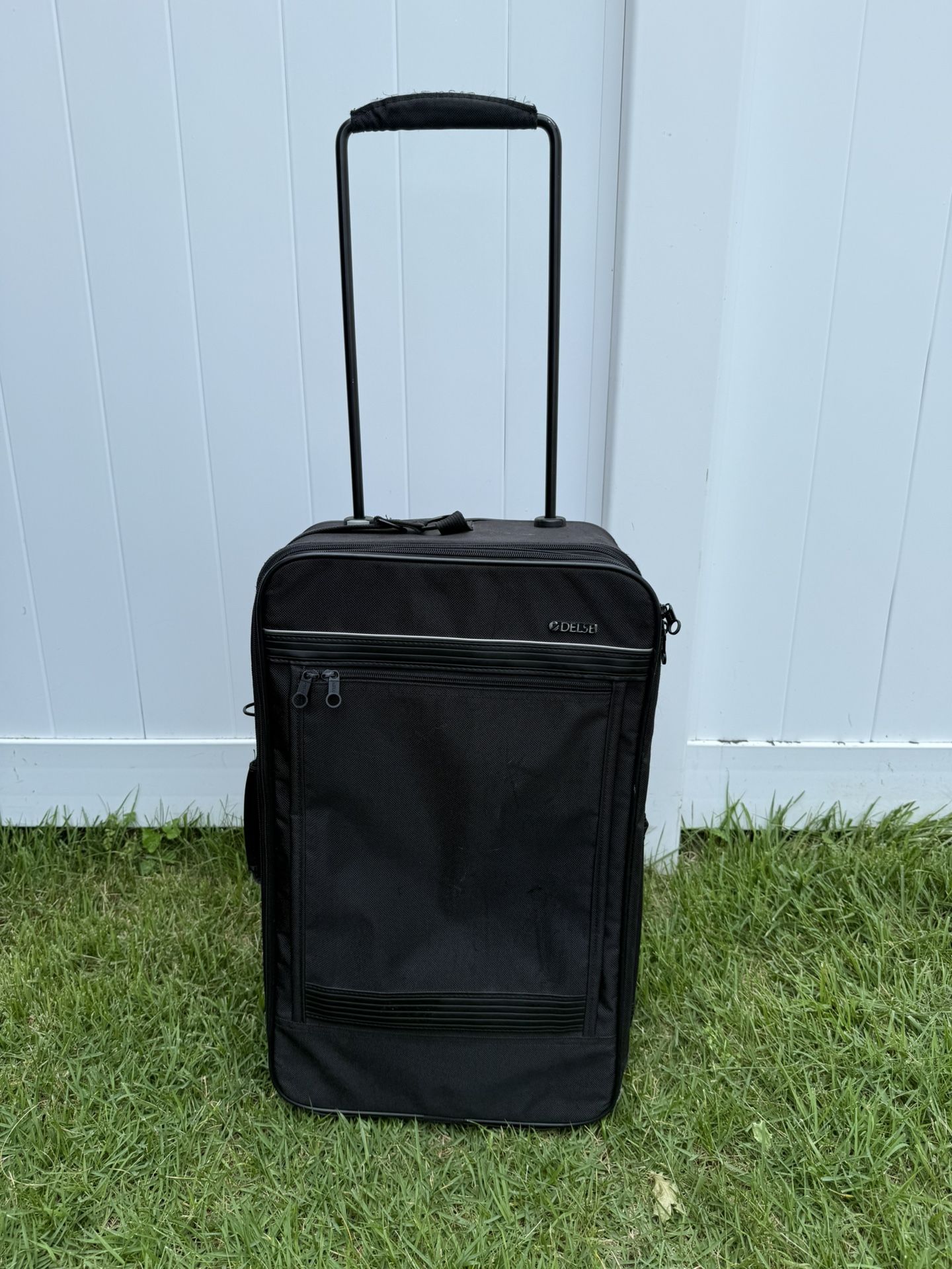 Small black rolling luggage by Delsey