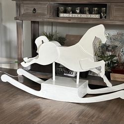 vintage  rocking horse hand made by family 45 yrs ago.  Solid hardwood. non toxic paint Family heirloom Nice for children to ride or fir home decore. 