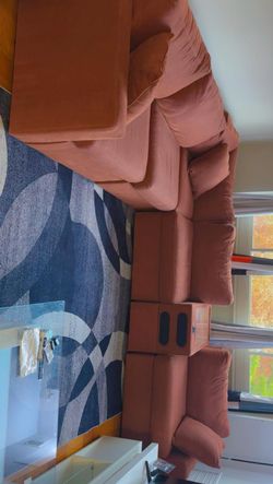 L-shaped couch with Bluetooth speakers attached