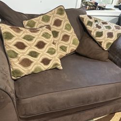 Two Couches With Many Cushions 