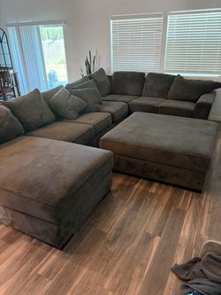 Large 3 piece sectional with chase and ottoman