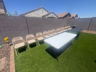 Two 6 ft folding tables and 13 folding chairs