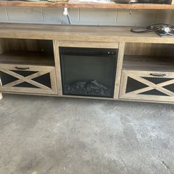 Pemberly Row 70" Rustic Farmhouse Fireplace TV Stand in gray wash, featuring distinctive X-accent mesh metal cabinet doors.