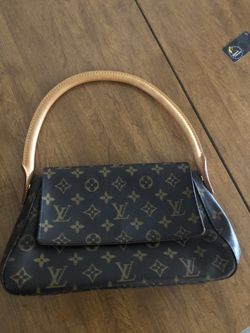 Authentic Louis Women’s hand Clutch /purse