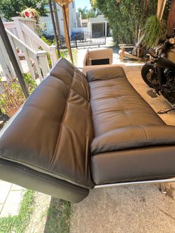 Black couch with side outlet