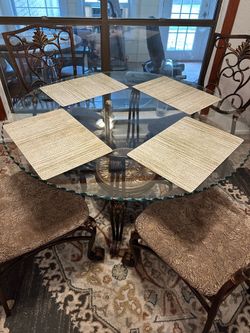 Glass round table with four chairs.