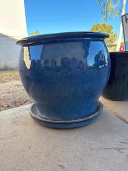 Glazed blue ceramic pot with drain hole