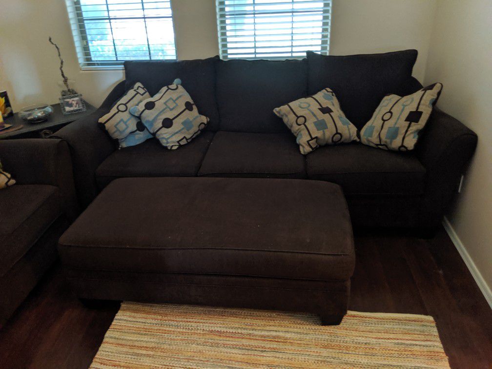 Couch, loveseat, large chair and ottoman with pillows
