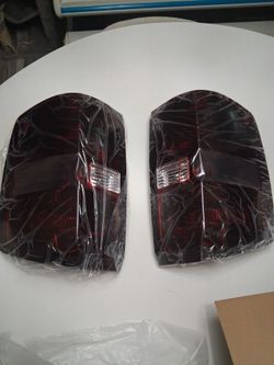 dark-red tail lights for the 2014-2019 Chevy Silverado 1500/2500/3500 and 2015-2019 GMC Sierra 2500/3500 HD with a factory 3-bulb design. The pair fea
