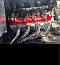 V8 Engine with Headers and Red Valve Covers