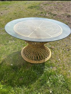 Mid century coffee table with glass top and rattan base