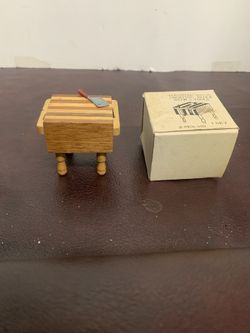  The vintage dollhouse butcher block is a charming addition to any miniature kitchen setting. Made of two-toned wood with a knife, th