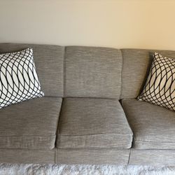 Gray Sofa, Accent Pillows & Rug