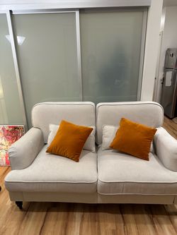 Small 2 person couch with cushions