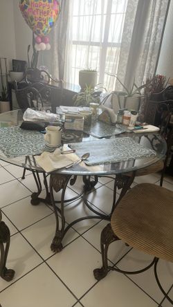Mesa redonda de cristal con 6 sillas