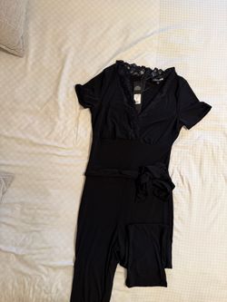 Black Lace V-Neck Jumpsuit size M