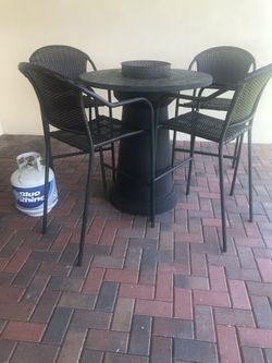 Fire table with four high top chairs and propane tank - all for only $200