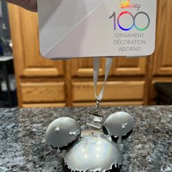 Disney 100th Anniversary Mickey Mouse Ear Hat Ornament.  Brand new on original card.  Smoke free home 