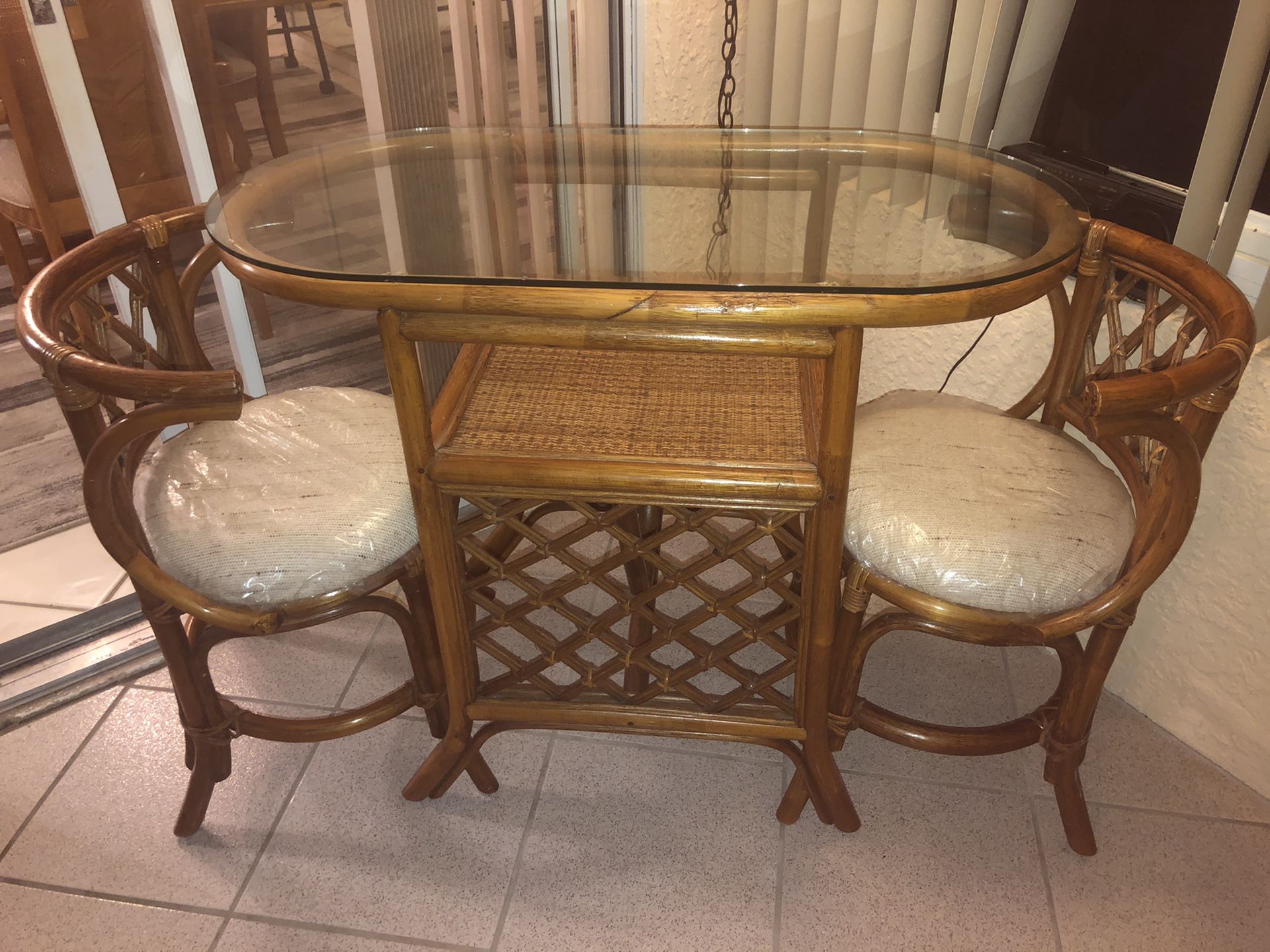 Wicker glass table and chairs