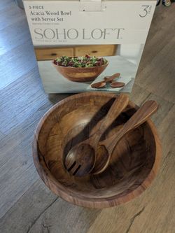 Wood pool salad with two spoon and fork