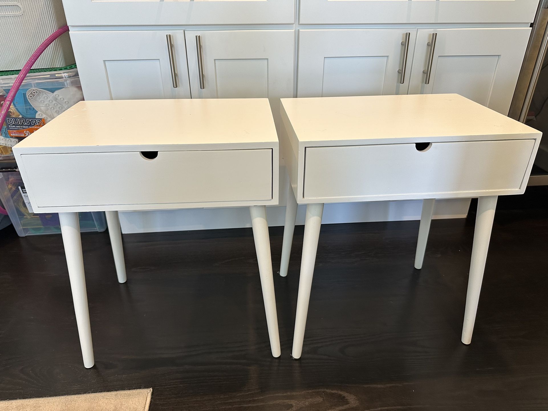 Two white bedside tables - single drawer