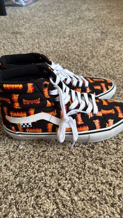 Vans Sk8-Hi Thrasher Allover Logo black high-top skate shoes.