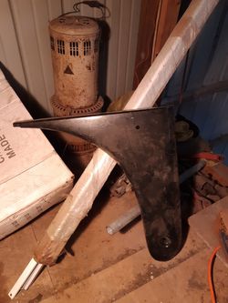 Dog leg for a Ford tractor