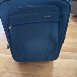 America Tourister 20” blue soft sided luggage