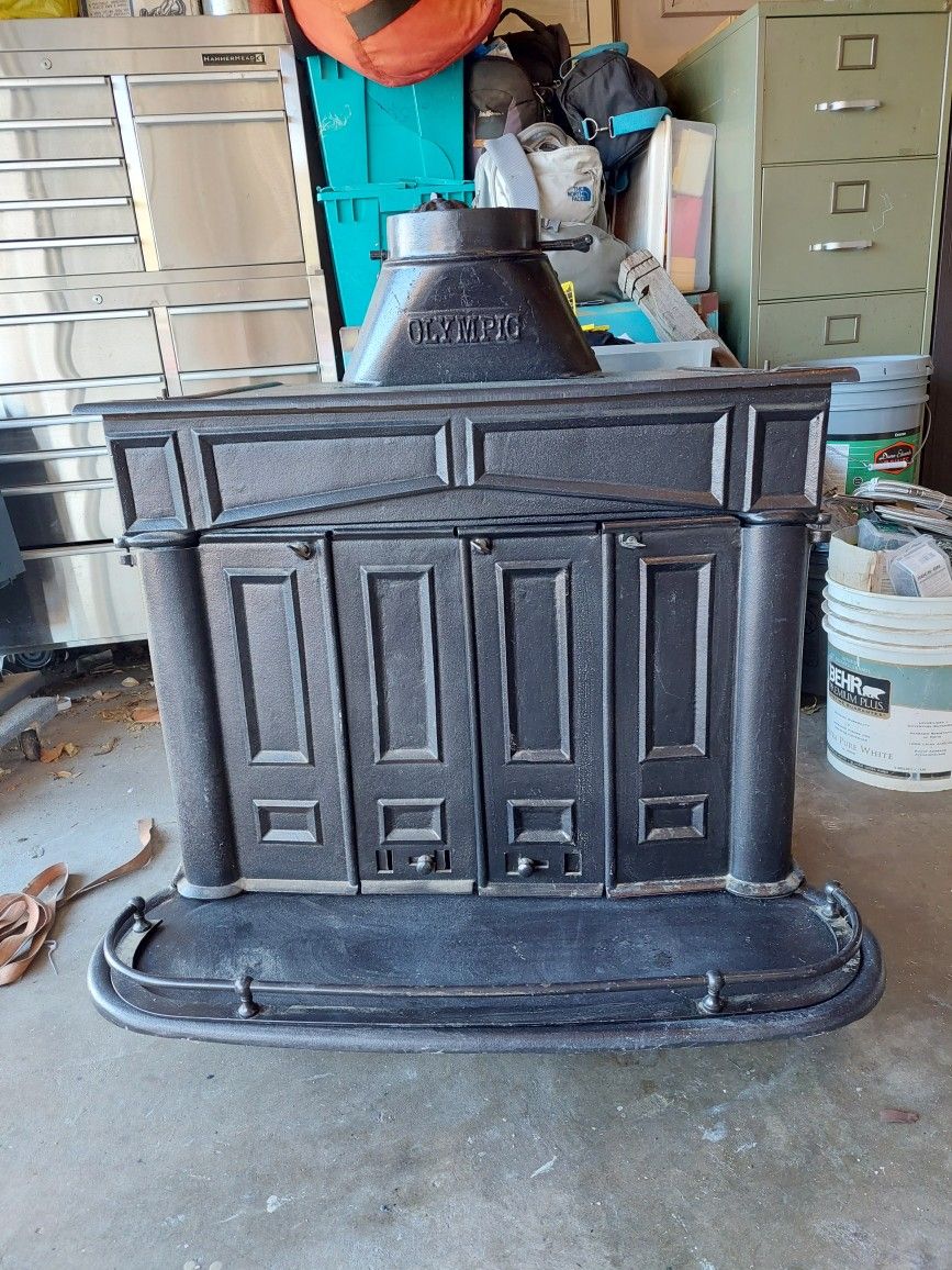 Olympic Old 1950s Swing Arm Wood Burning. Stove