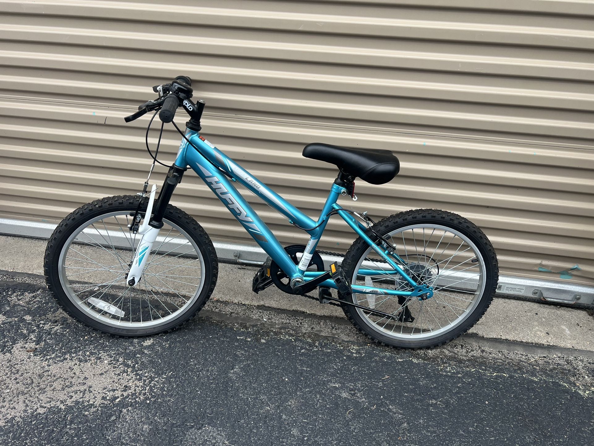 Blue Huffy mountain bike Kids