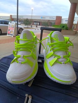 Nike Kyrie Flytrap 4 in the "Barely Volt" / "Fluorescent Yellow" colorway.