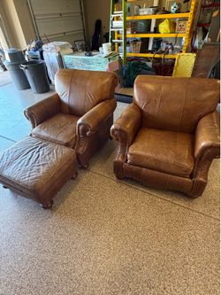 Two Leather Club Chairs & Ottoman