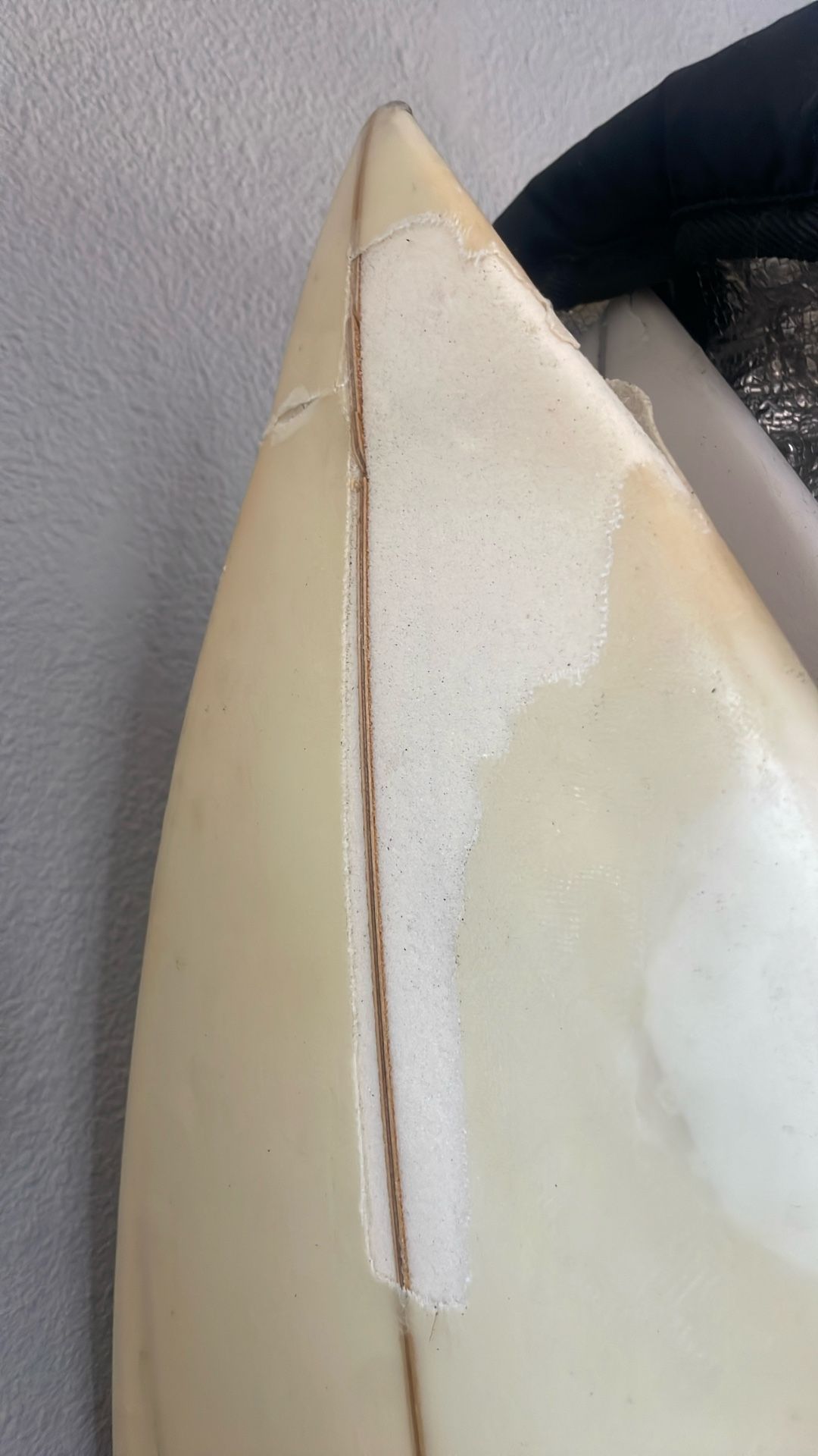 buckled lost surfboard