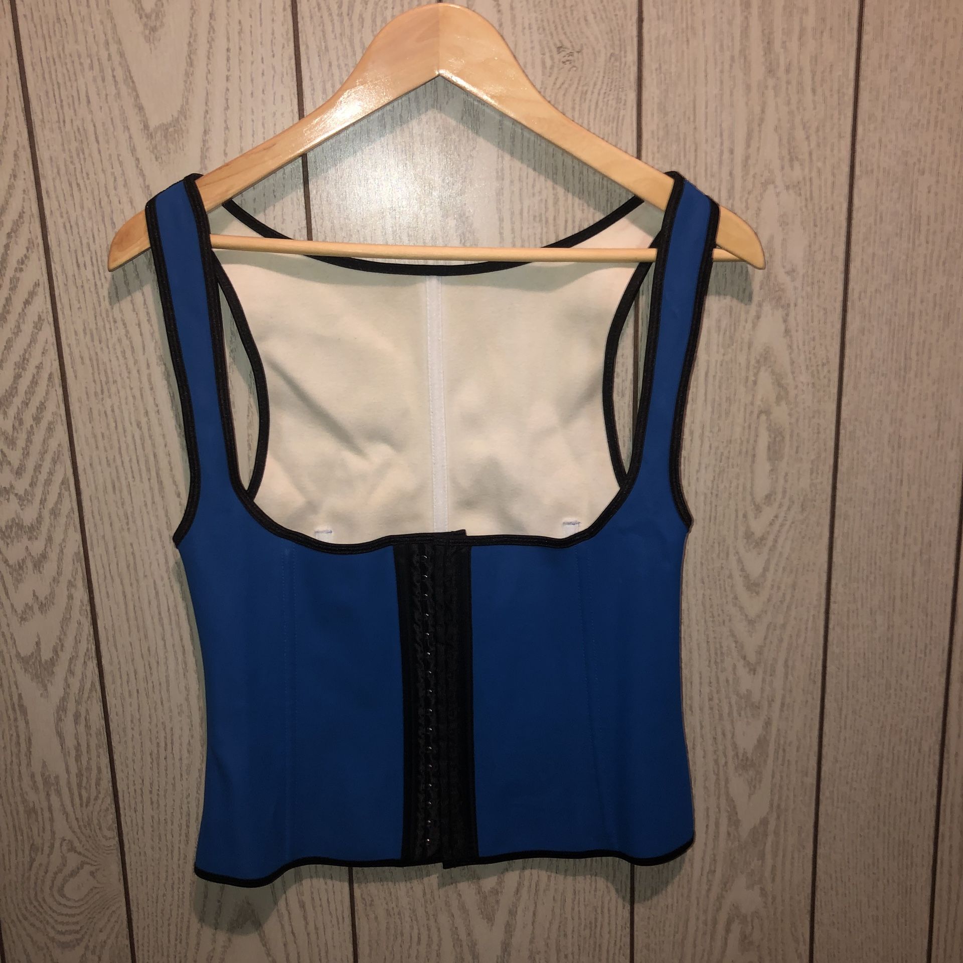 Size large (looks bigger to me. The measurements are posted in a picture) royal blue and black corset shape wear that hooks all up the front at diffe