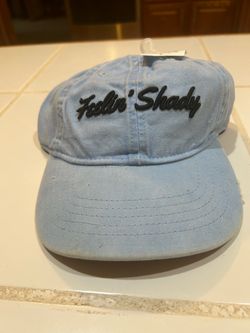 light blue distressed dad hat features black script embroidery reading "Feelin' Shady" and is made by Infinity Headwear