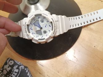 CASIO G-SHOCK GA-100A watch in white.