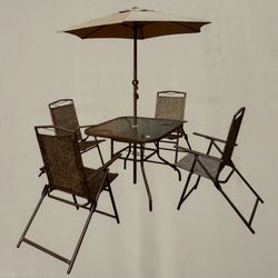 New 6 piece patio set, Four fold chair , table And  umbrella 