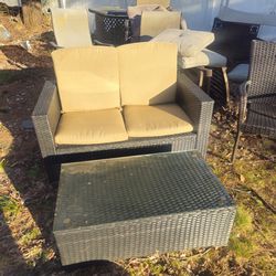 The prices firm.. cute little loveseat with glass top coffee table and free armchair