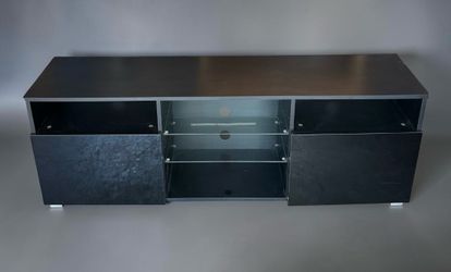 Black TV entertainment center media console . Excellent condition . Measurement : 14 deep x  57L x 21H.